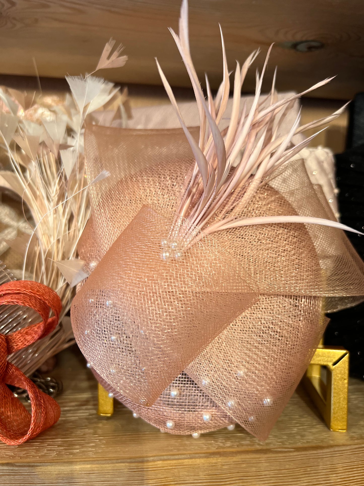 Nude pearl and feather hatinator