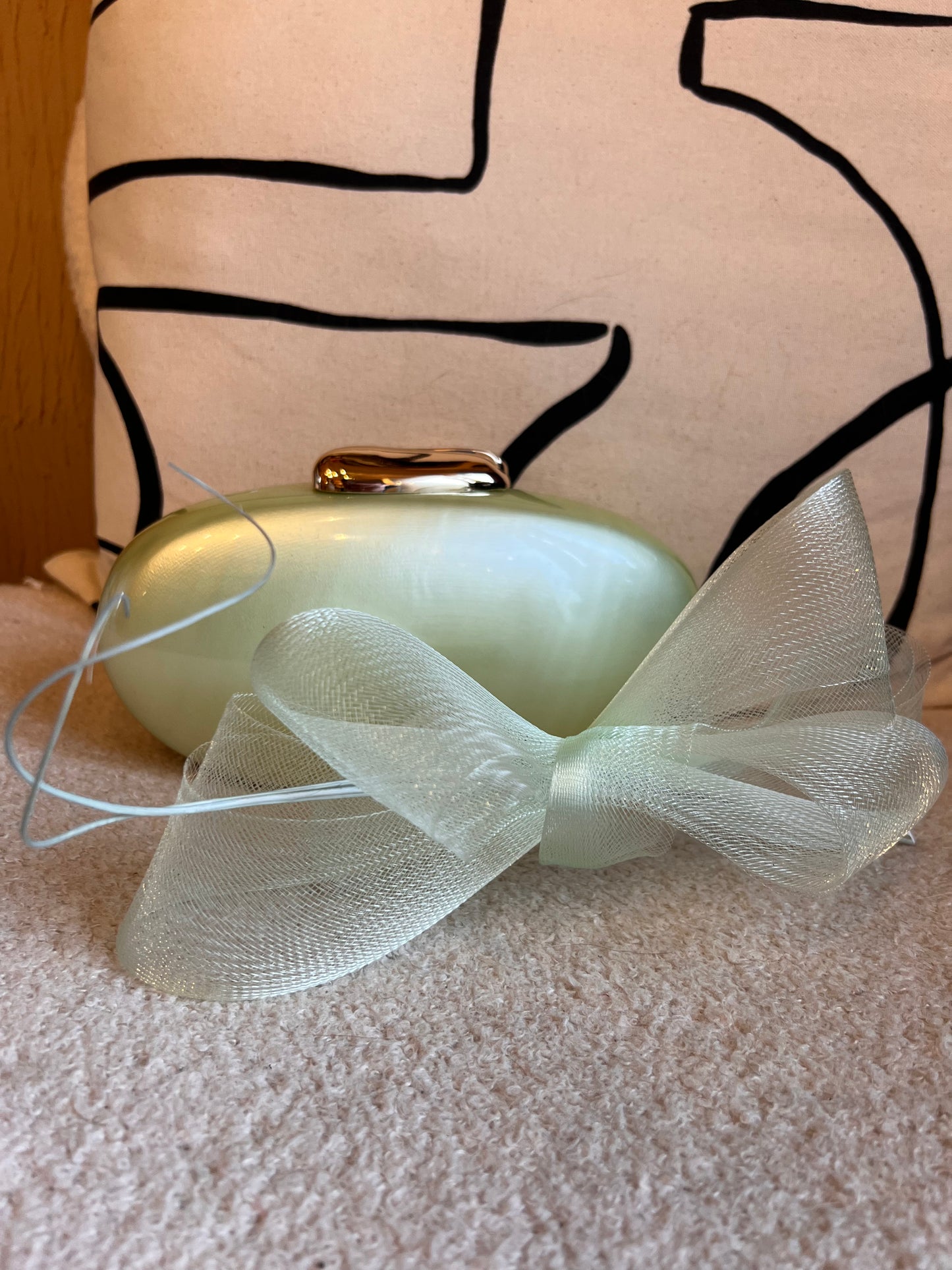 Sage green fascinator and clutch bag