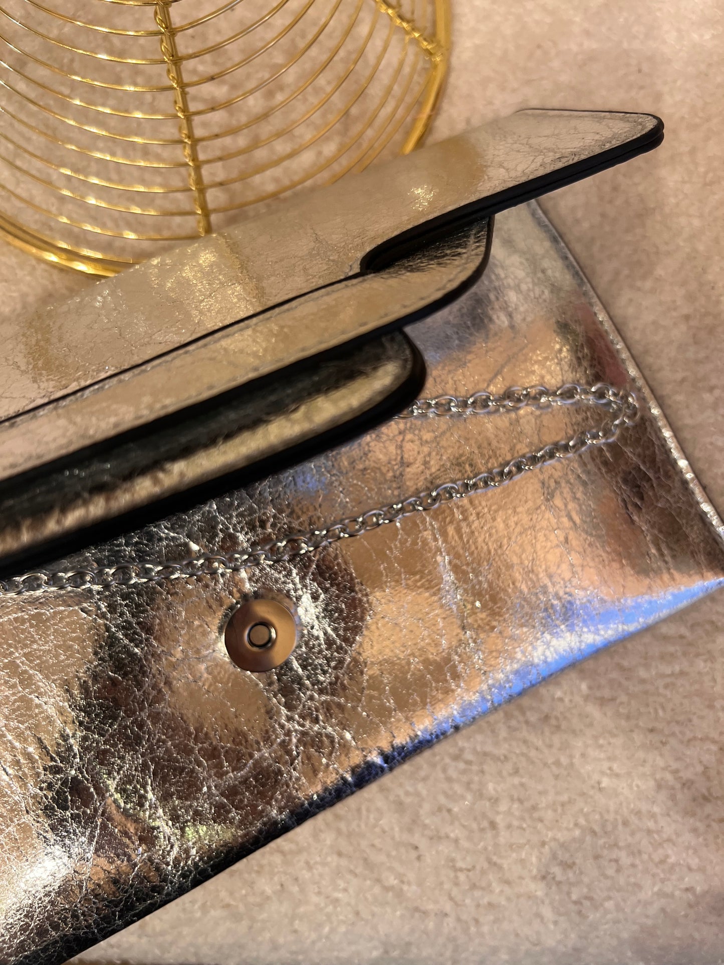 Silver metallic clutch bag